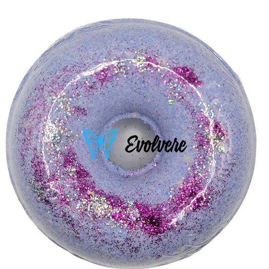 Purple donut shaped bath bomb with purple and silver skin safe glitter.