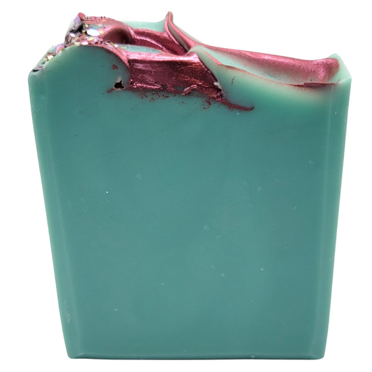 A beautiful turquoise  soap topped with a burgundy accent