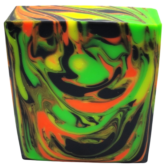 Bar soap in beautifully swirled neon colors of green, yellow and orange with a black background.