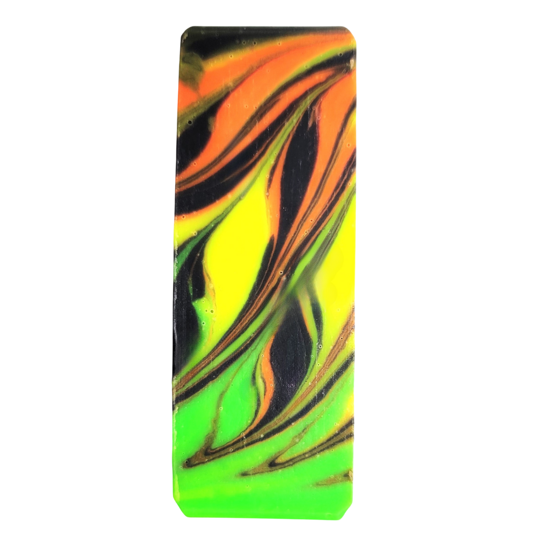 Soap top swirled in neon colors of orange, green and yellow with a black background.