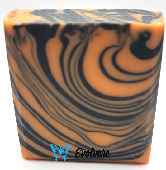 Bar soap with a tiger inspired swirl and color pallet. Orange and black.