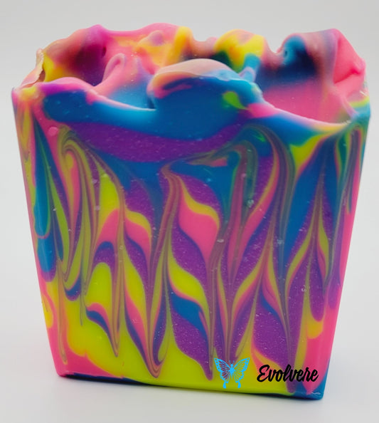 A beautifully swirled neon colored soap in pink, yellow, purple and blue.