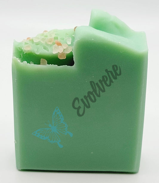 A beautiful light green soap topped with Pink Sea Salt 