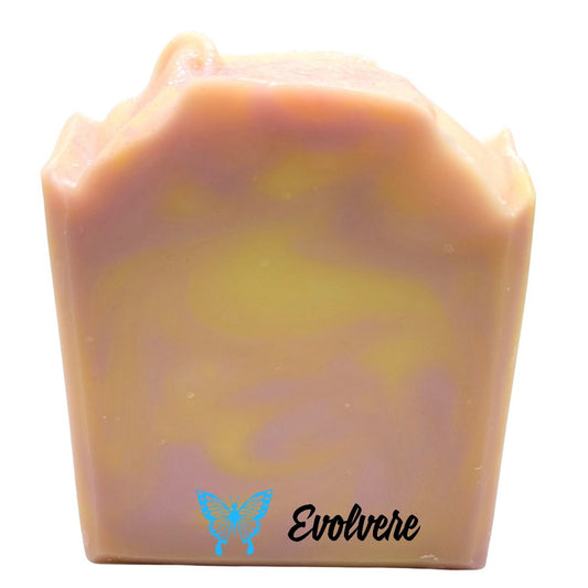 A soft pink soap with a light yellow swirl.