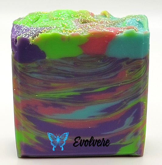 A beautiful multi-colored soap in bright colors - topped with biodegradable glitter. Colors include, purple, green, pink and blue.