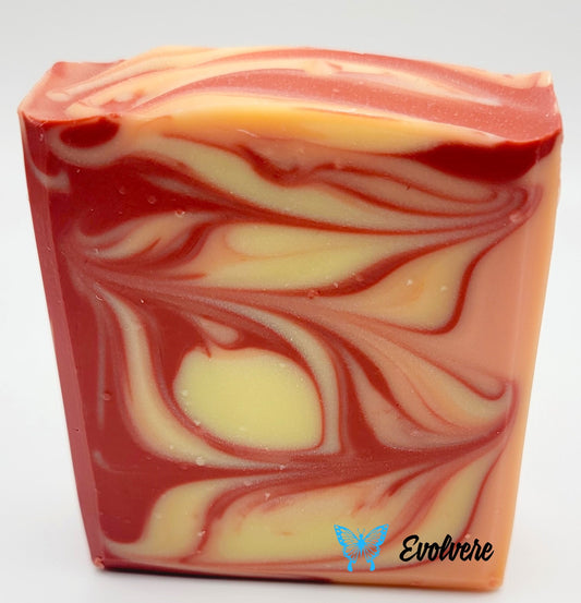 An orange, red and yellow swirled soap bar. 