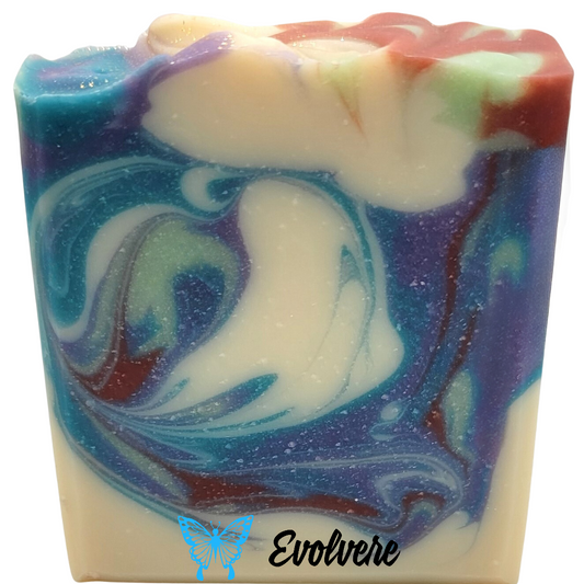 A beautifully swirled soap in white, blue, purple, light green and burgundy.