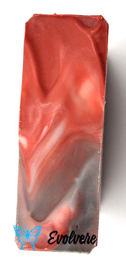 Top of soap with white red and black swirls
