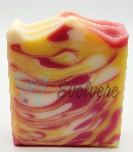 A dark pink, white and yellow swirled soap 