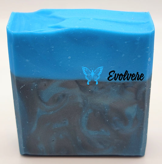 Soap bar with sea blue top and dark gray and blue swirled bottom