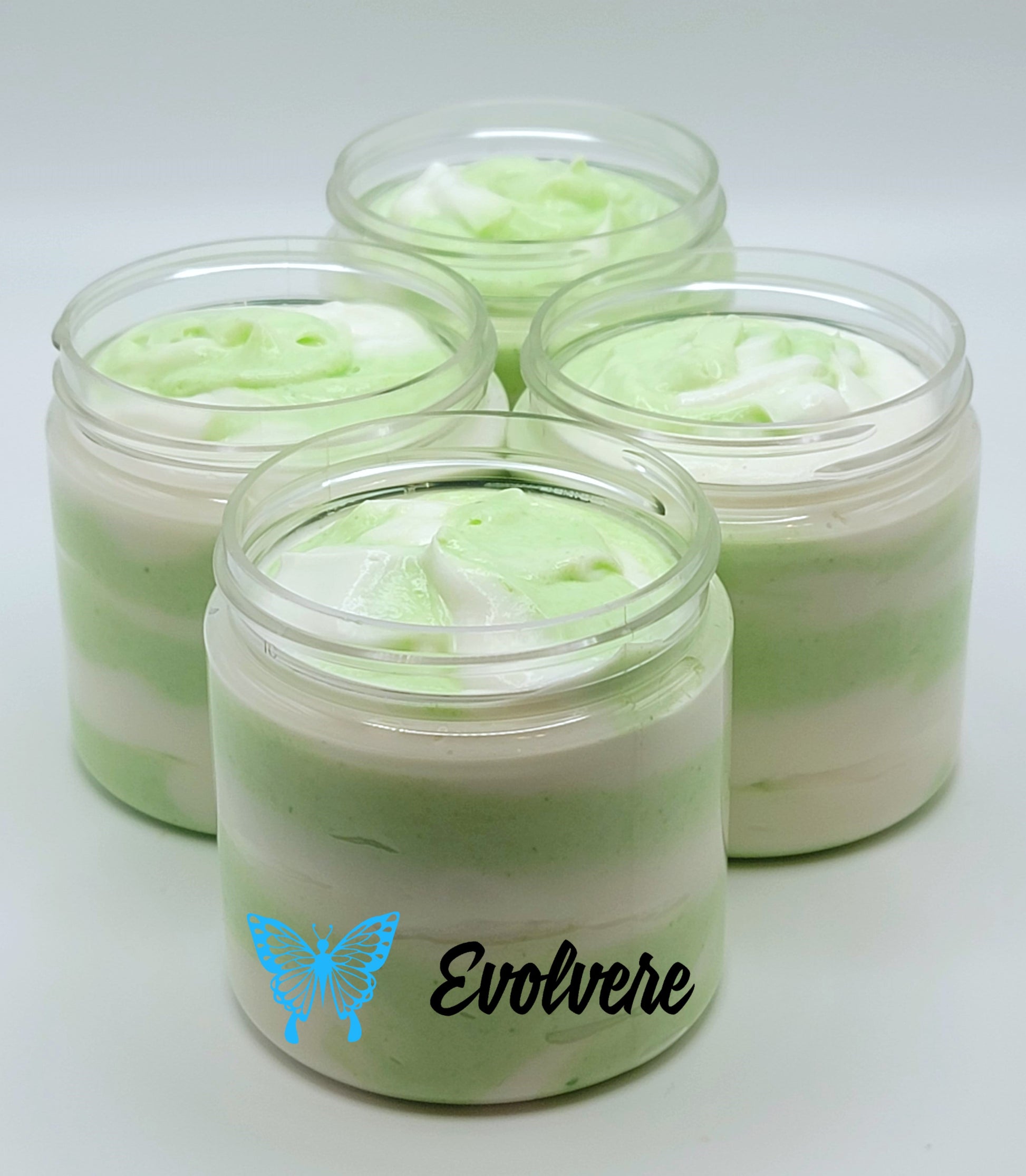 Green and white swirled body butter shown in 4 jars - listing is for 1 jar