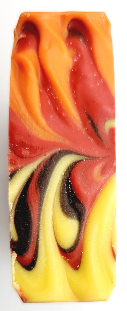 A lovely swirled top of fall colors, orange, yellow, red and brown.