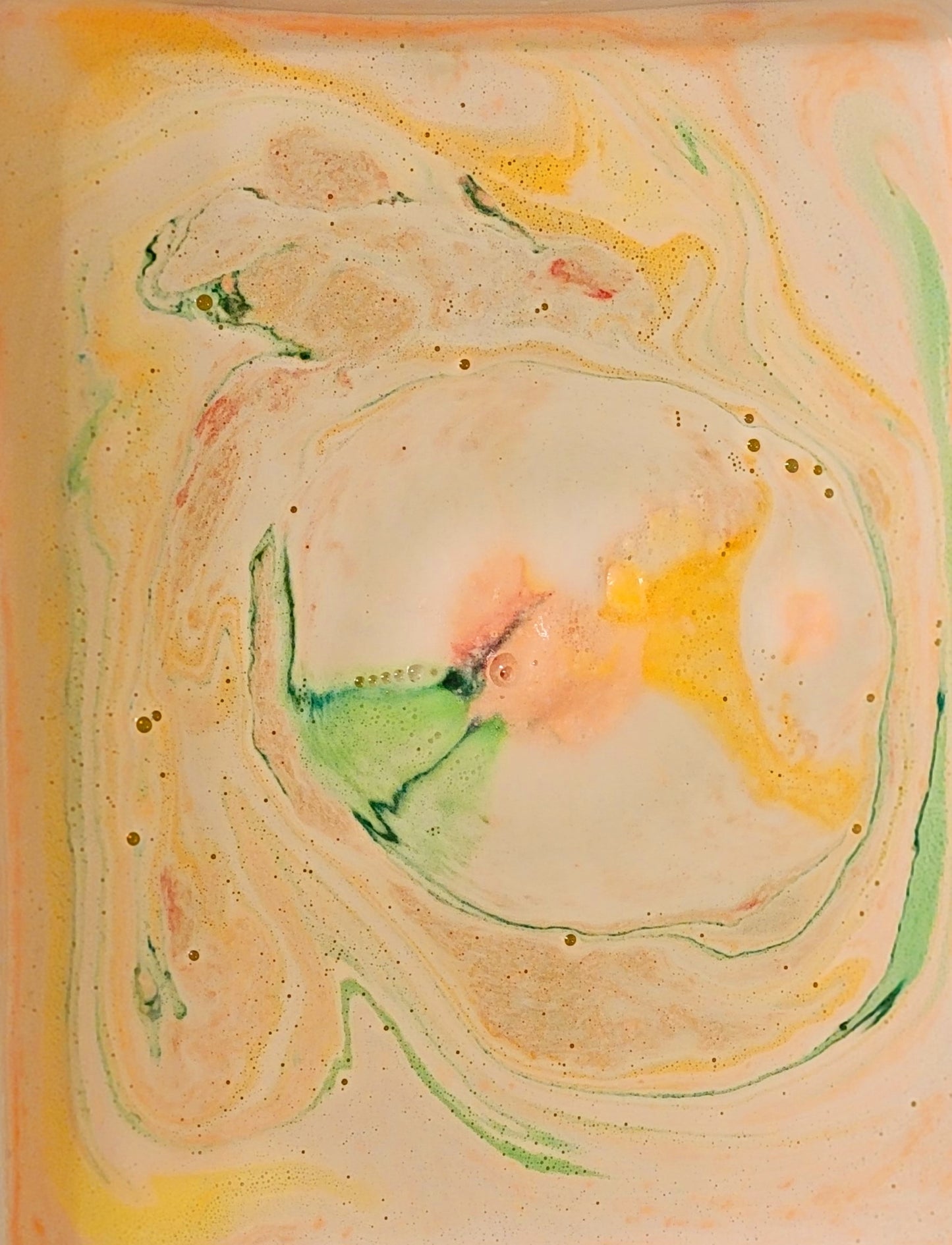 Multi-colored water result of bath bomb. 