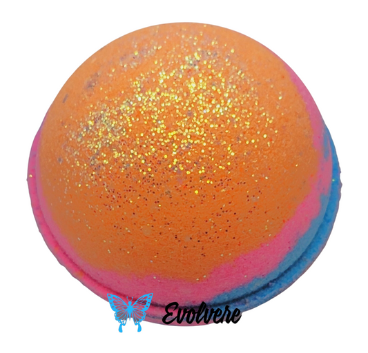 An orange, pink and blue round bath art bath bomb. The bath bomb creates a multi color display when placed in bath water. Listing is for 1 bath bomb.